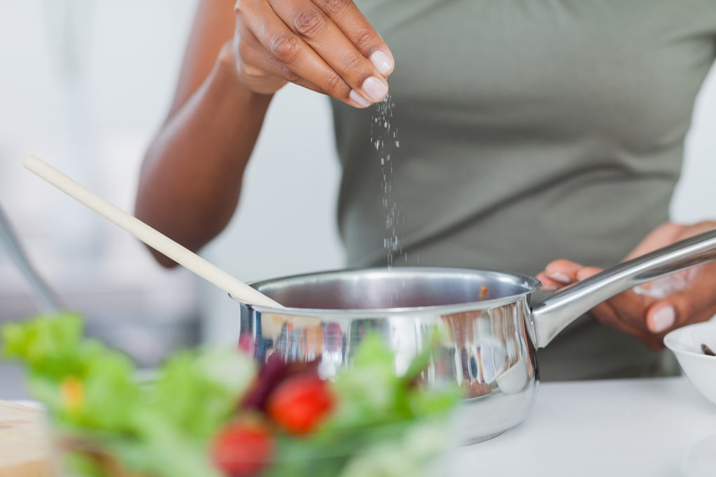 seasoning food with salt