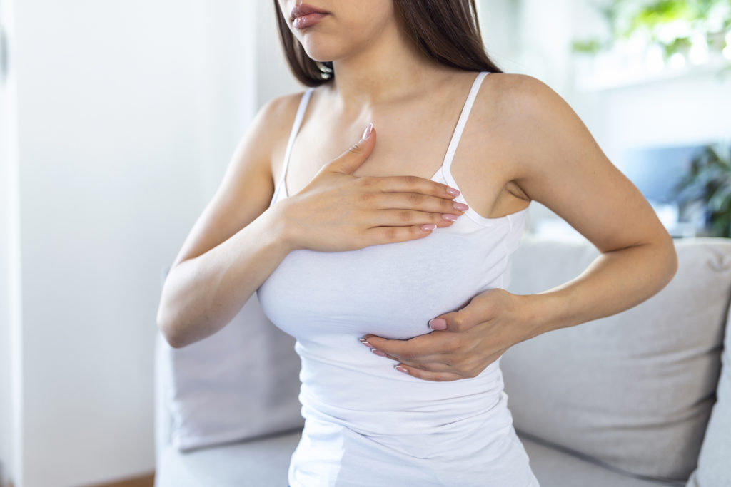 Woman doing a self breast exam