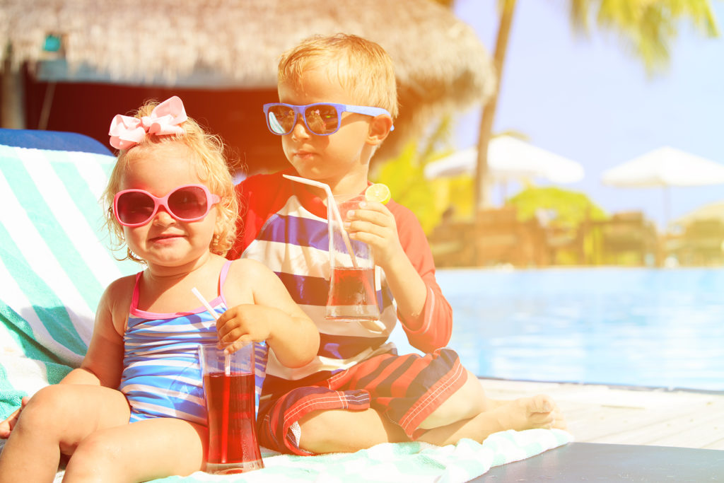 kids relax on tropical beach resort