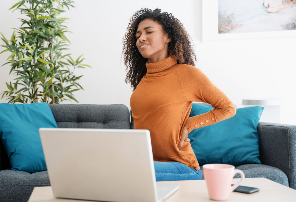 Young black woman suffer back pain cramp