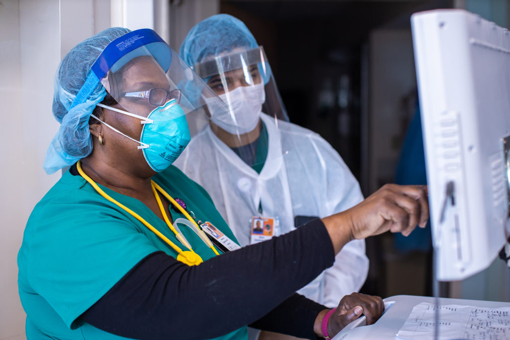 Two UHealth experts in PPE