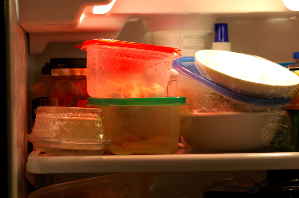 Leftovers stacked in the fridge.