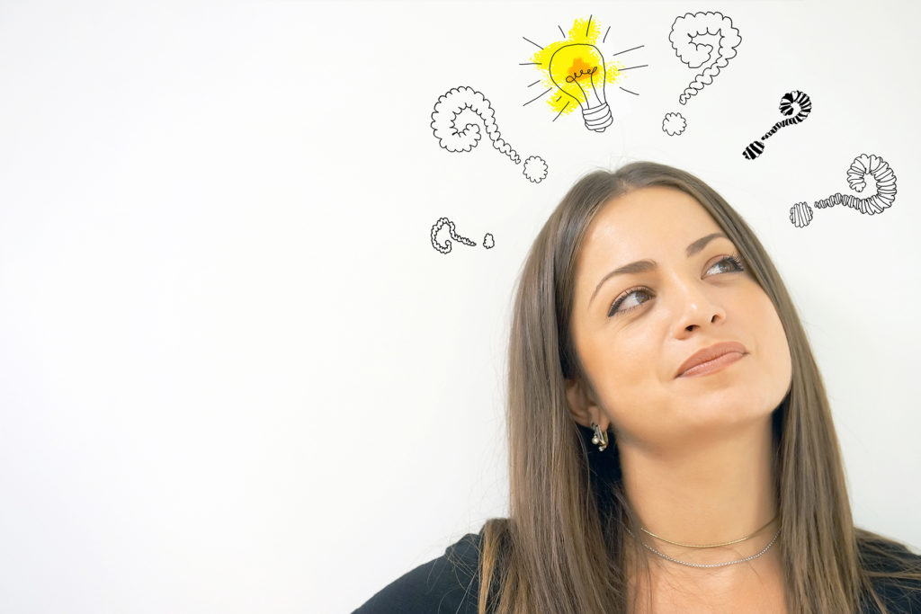 light bulb and question mark over woman's head