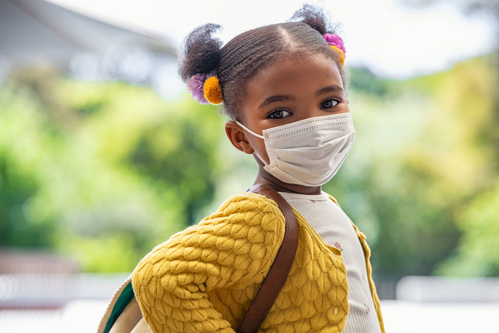 Young Black girl wearing covid mask