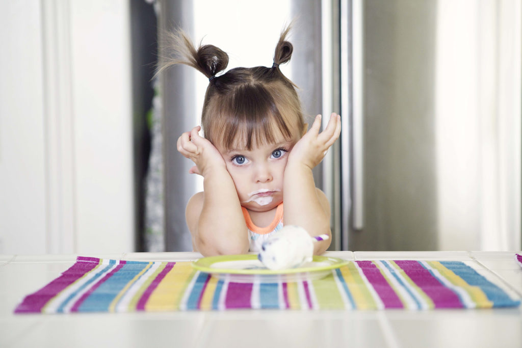 Little girl eating ice cream