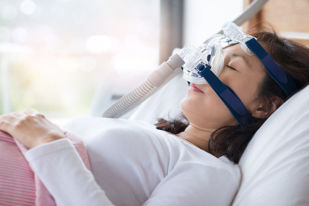 Woman on cpap machine due to sleep apnea