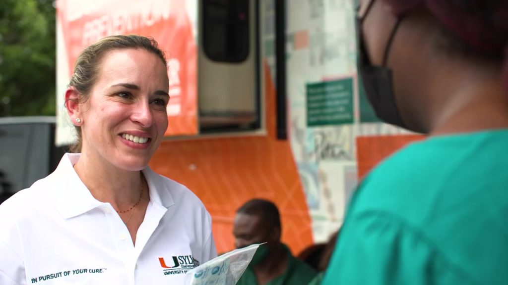 Erin Kobetz in front of game Changer vehicle