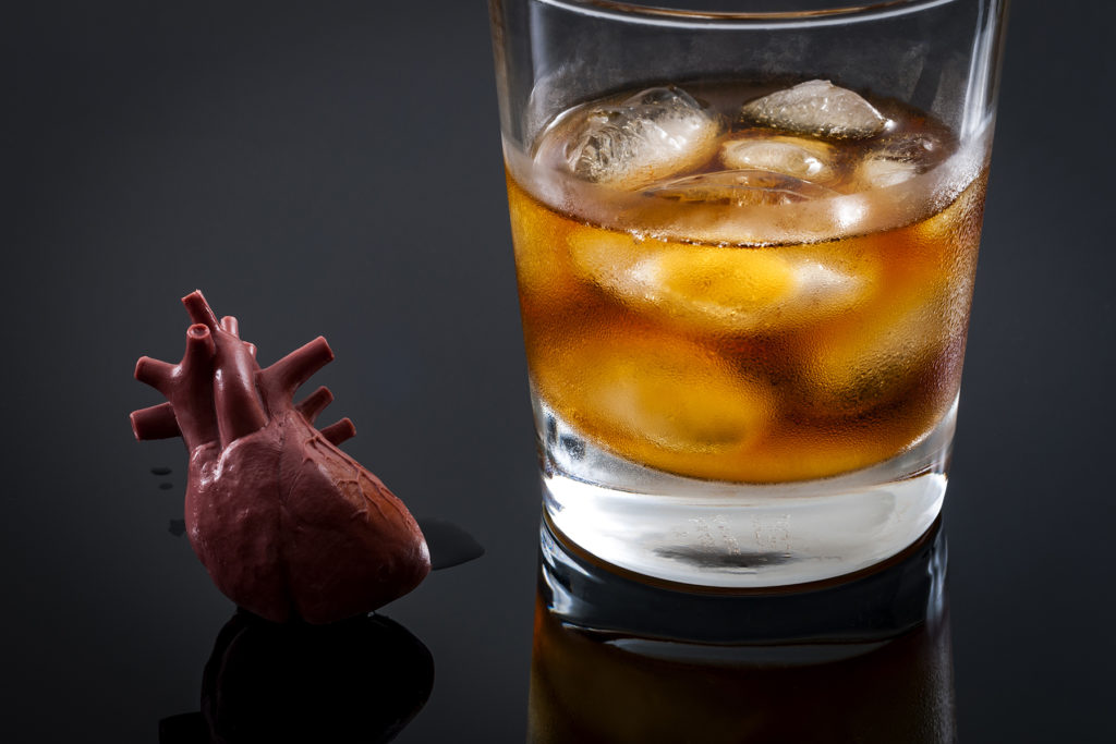 cocktail on table next to shriveled heart