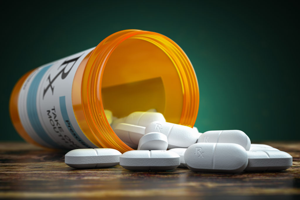 pills spill out from prescription bottle