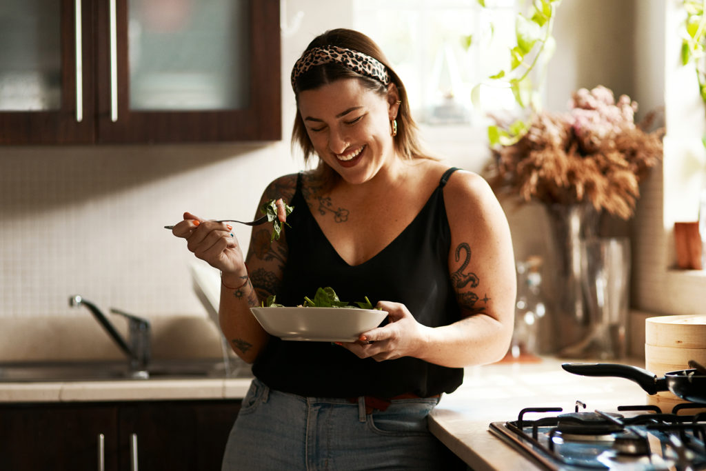 Woman enjoys vegan meal