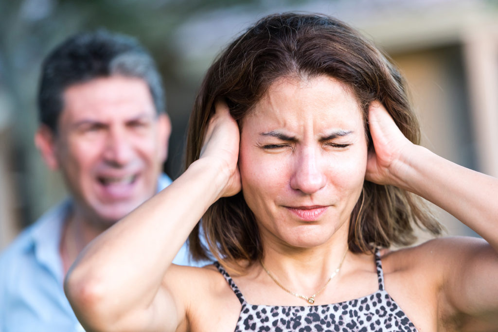 Hispanic couple arguing.