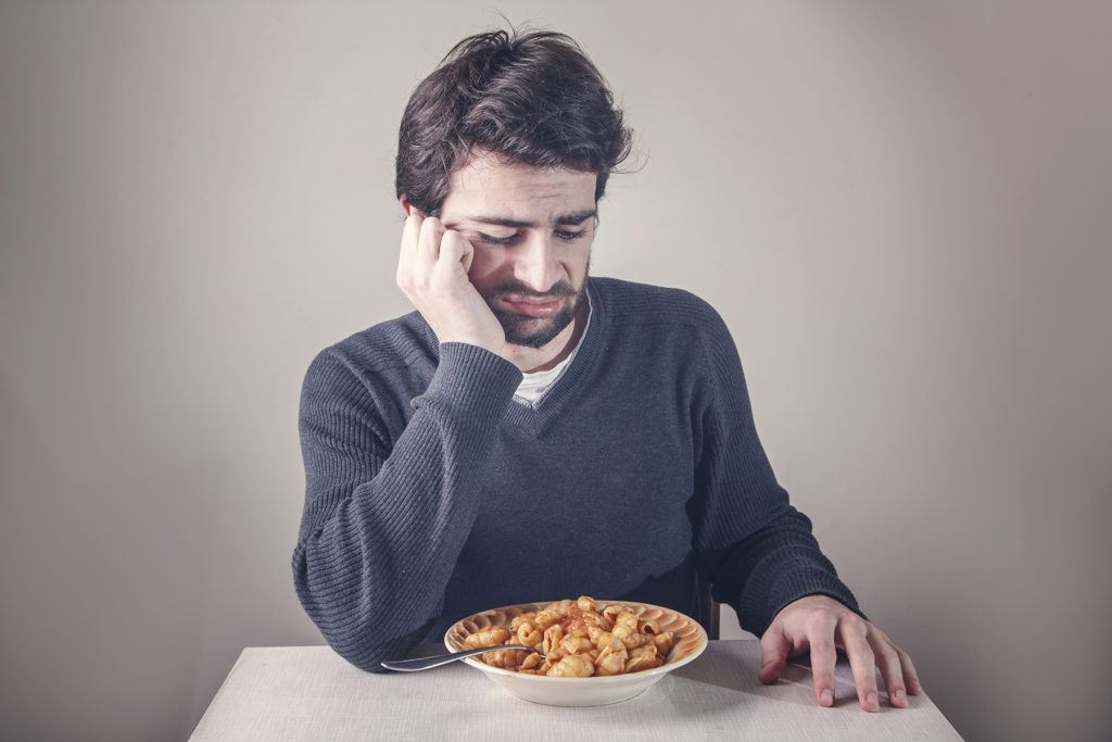 Disgusted man doesn't want to eat